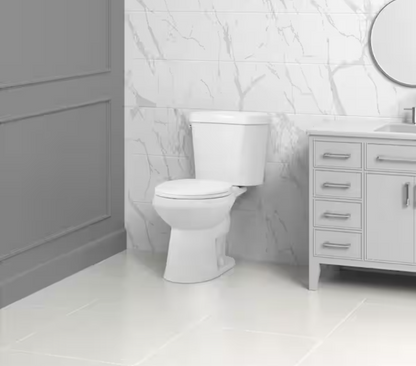10 in. Rough in 2-Piece 1.28 GPF Single Flush Round Front Toilet in White, Seat Included